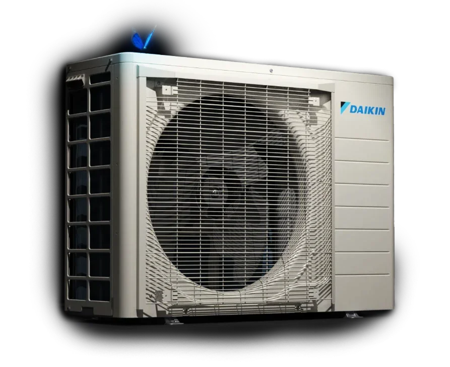A Daikin outdoor air conditioning unit with a large fan and protective grille, photographed against a white background. The Daikin logo is visible on the side.