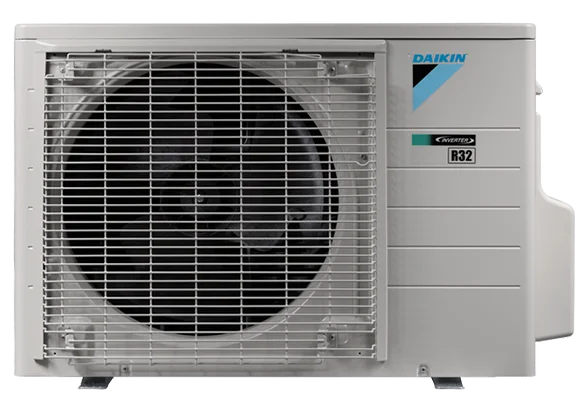 A Daikin outdoor air conditioning unit with a large black fan behind a metal grille and control labels, including an R32 refrigerant sticker, on its front panel.